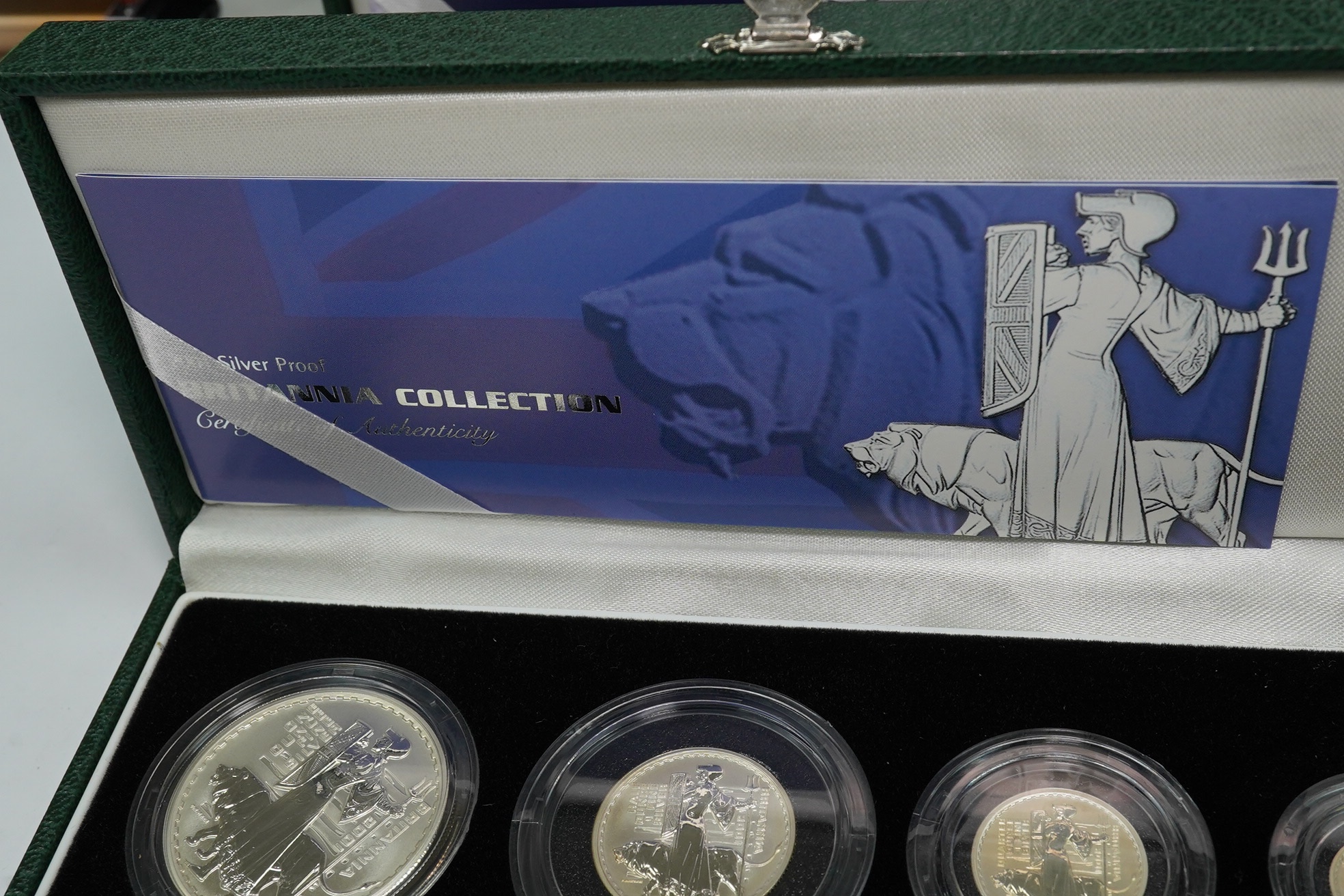 Royal Mint UK QEII coins, four Britannia collection silver proof four-coin sets, 1997, 2001, 2005 and 2007, in case of issue with certificate (4)